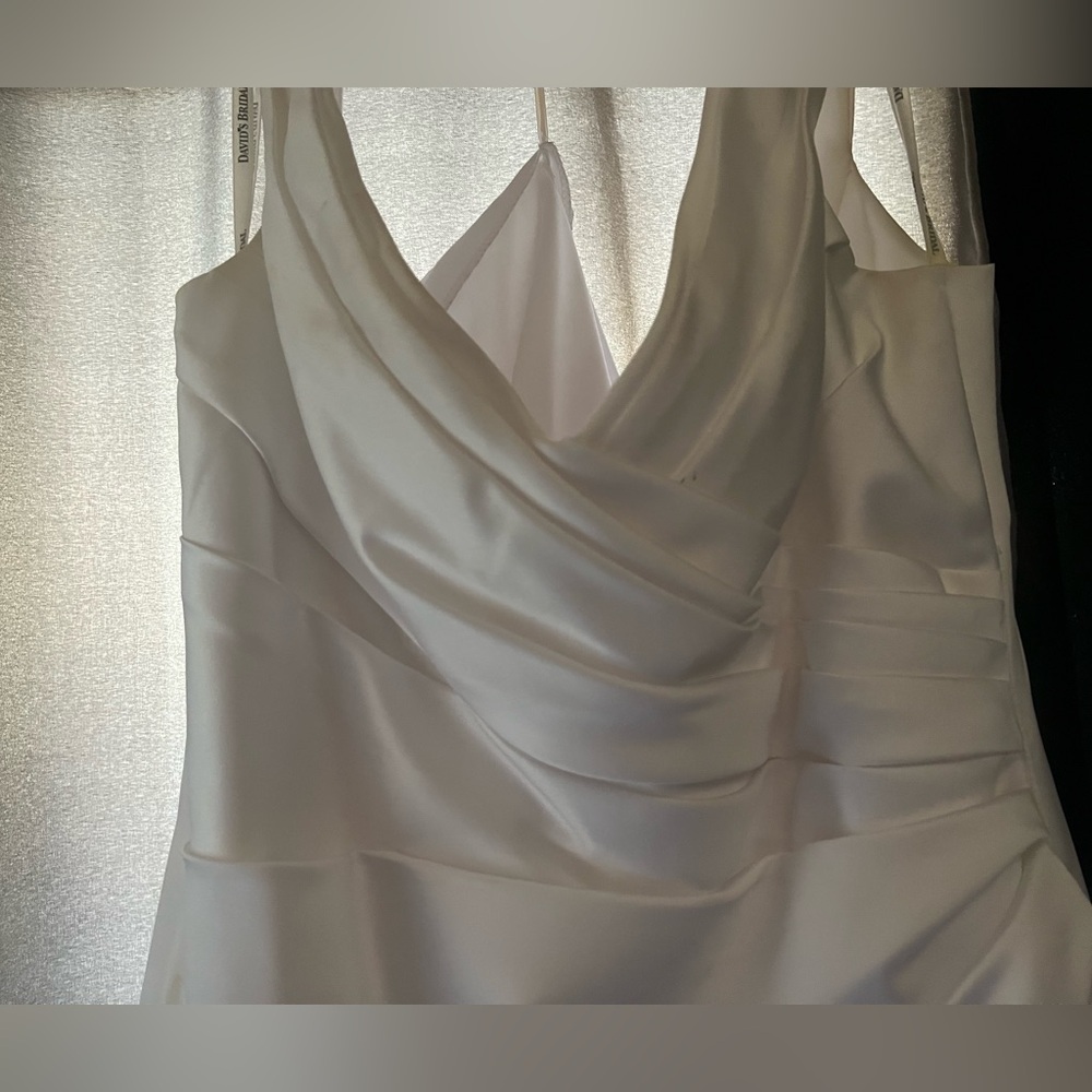 David’s bridal wedding dress used once all white with small train. Size 16